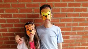 Two volunteers wearing animal masks