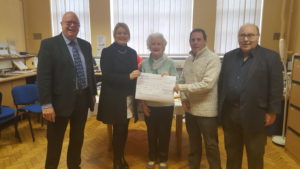 Harry Cowd chair of board of trustees, Hannah Doody Director of Social Services Merton, Bridie Alexander our lucky winner, Kevin Gregory Service manager MertonVision and Steve Moore Trustee and Treasurer.