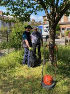 volunteers clearing the gardens