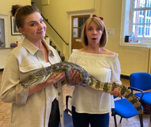 staff holding a crocodile!